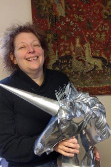 Image of Medieval Institute Director, Jana K. Schulman, holding the college trophy.