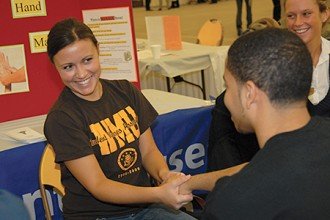 Photo of a student receiving a hand massage.