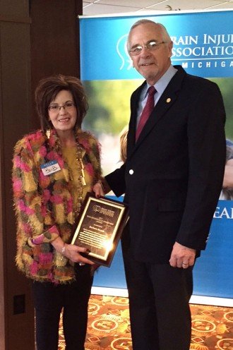 Photo of Dr. Barbara Barton receiving her award.