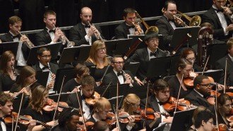group shot of the wmu symphony orchestra in the pit