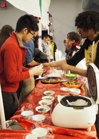 Photo of students serving traditional Japanese food during the 2016 International Education Week.