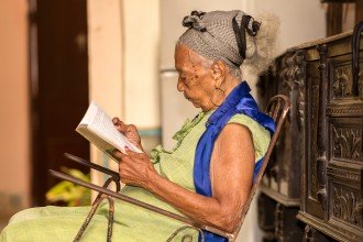 Photo of an older woman reading.