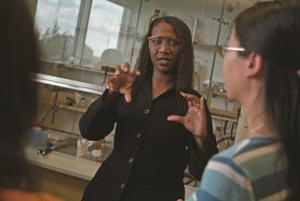Photo of professor in lab with student