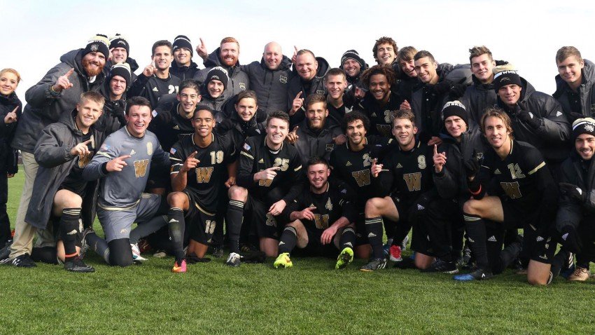 Photo of the Bronco men's soccer team crouched together and kneeling on a soccer field with some players holding up their index fingers to signal No. 1.