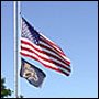 Photo of flags at half-staff.