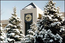 Photo of a snow-covered Stewart Clock Tower.