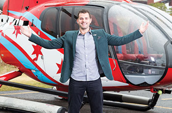 Heffernan in front of helicopter