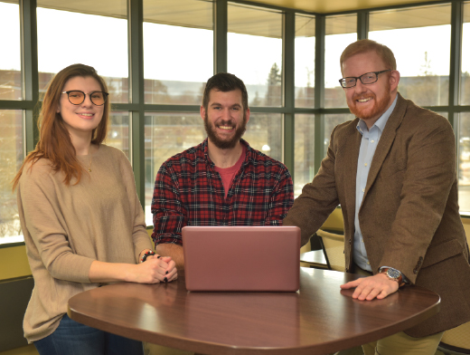 Pictured are Dr. Scott Cowley and two students at the Haworth College of Business