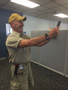 Maintenance services employee poses for a selfie