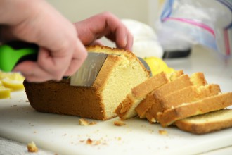 student cutting bread