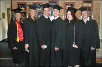 Photo of students in graduation robes