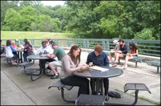 Photo of students studying on terrace