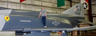 Claire Ranly standing on the F-4E Phantom
