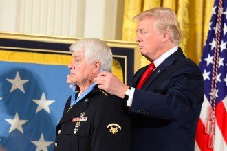 President Donald Trump drapes WMU alumnus James McCloughan with the Medal of Honor at the White House.