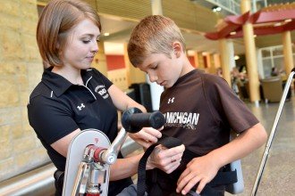 Photo of WMU OT student with a patient.