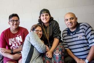 A family poses together in the WMU residence halls.