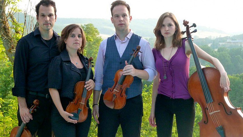 Photo of members of the Mivos Quartet.