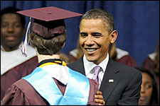 Photo of President Barak Obama congratulating Kalamazoo Central High School graduate.