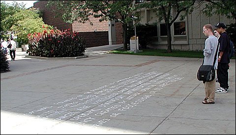 Students reading chalk writing